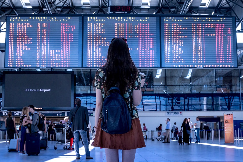 girl waiting for his taxi on the airport