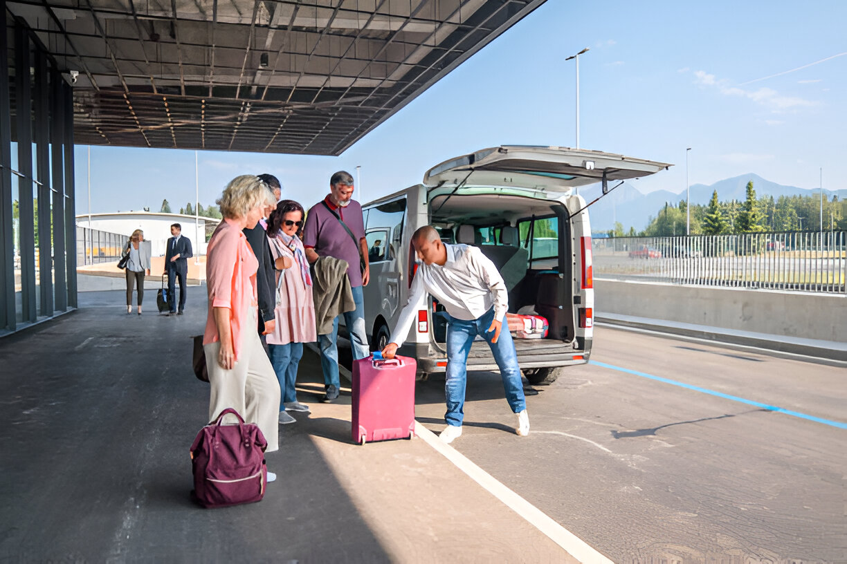 driver assisting passenger on the airport